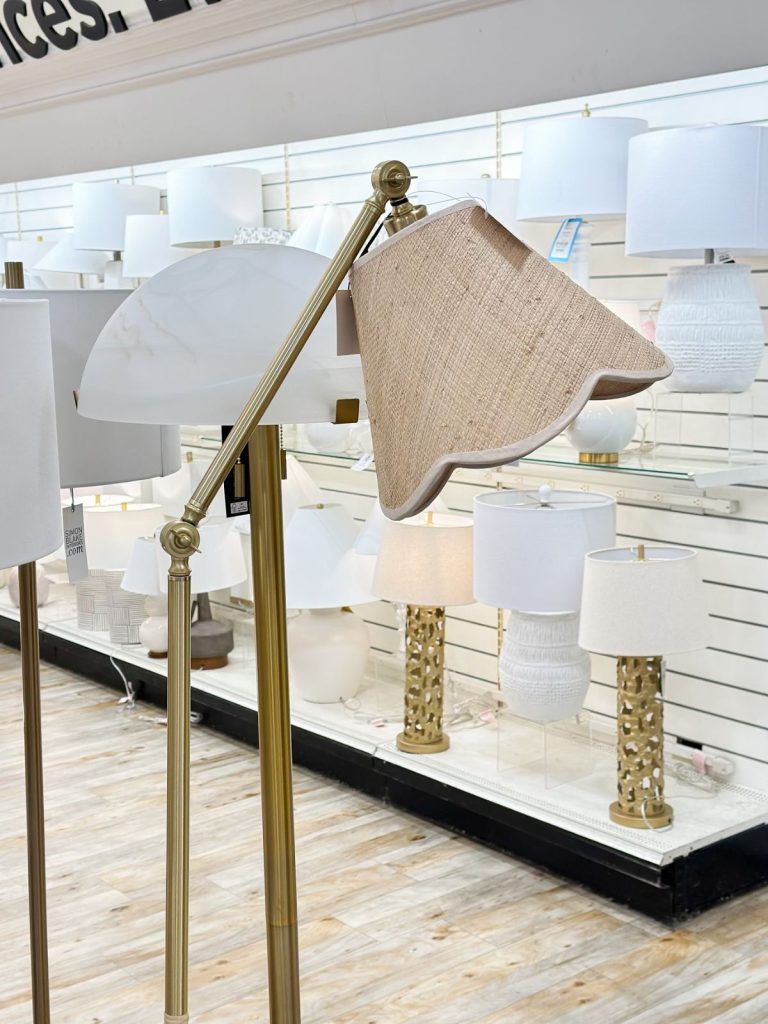 a rattan scalloped lamp in a HomeGoods store