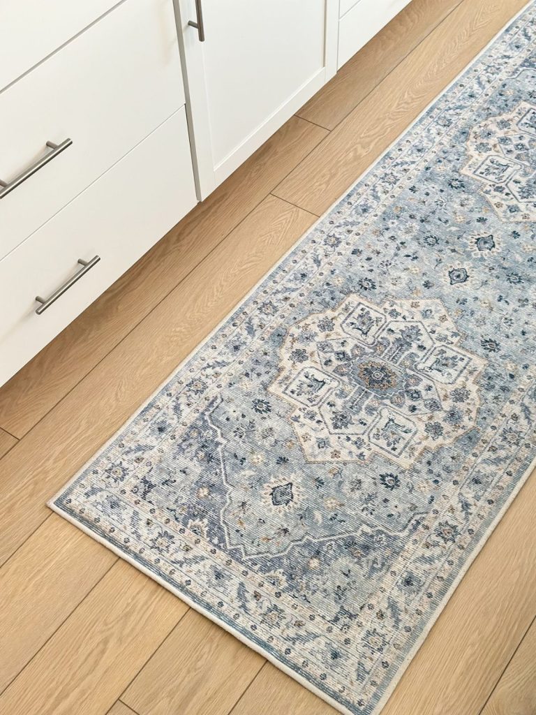 a blue and white kitchen runner rug