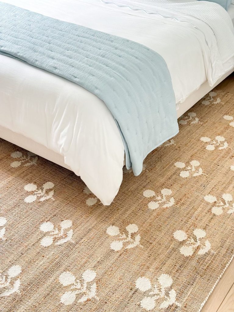 a natural rug under a bed