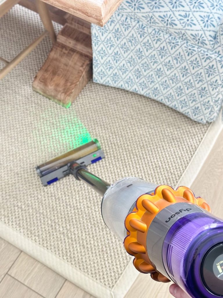 a vacuum cleaning carpet in a living room
