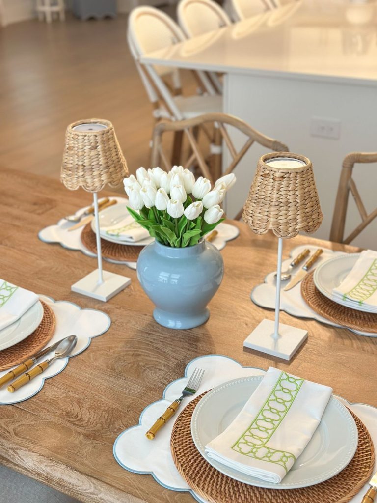 a blue ginger jar vase spring table centerpiece surrounded by two wireless lamps
